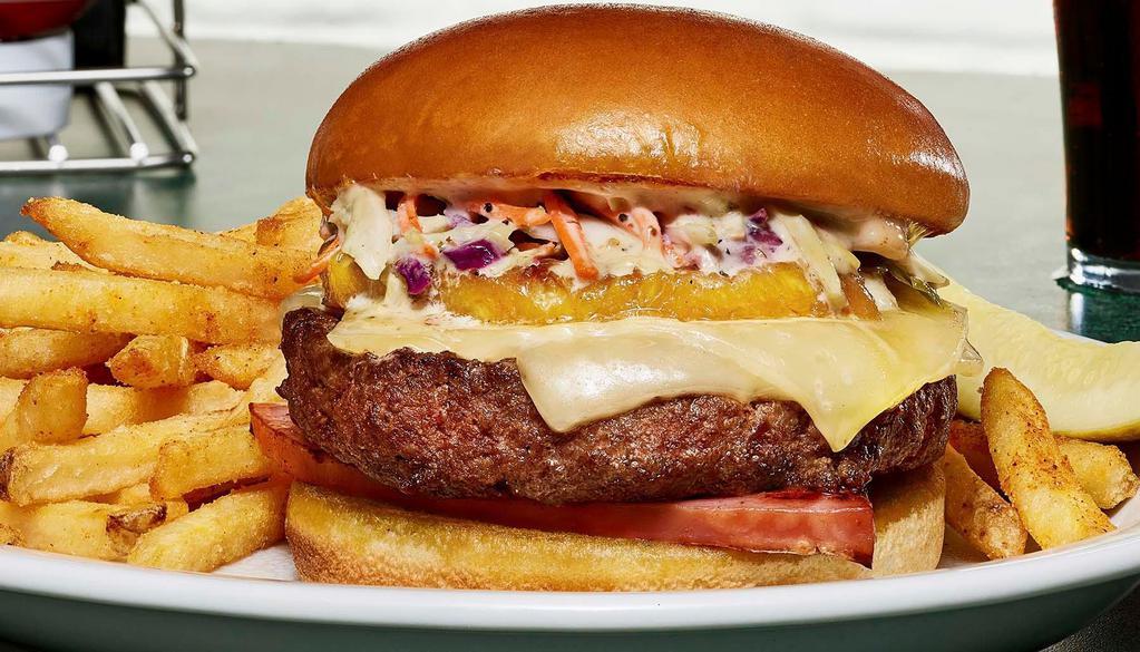 Hawaiian Burger · 100% Angus burger topped with grilled pineapple and ham slice, Swiss cheese, creamy coleslaw, and citrus aioli.