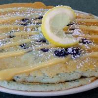 Blueberry Lemon Pancakes  · Two pancakes infused with blueberries and lemon, drizzled with cream cheese icing and  powde...