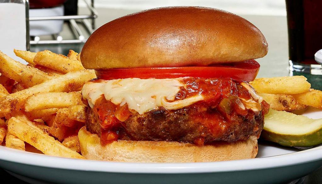 Italian Bada Boom! Burger · 100% Angus burger topped with a hearty marinara blended with onions and green peppers, tomato slice, and melted provel cheese.