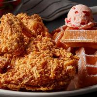 Fried Chicken & Waffle · Half a fried chicken and a Belgian waffle, topped with powdered sugar and sweet, strawberry ...