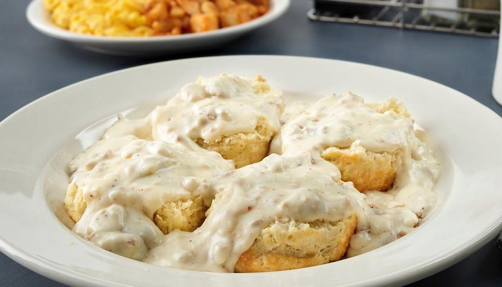 Biscuits & Sausage Gravy · Two buttermilk biscuits topped with our housemade sausage gravy, accompanied by two eggs any style and served with hashbrowns.