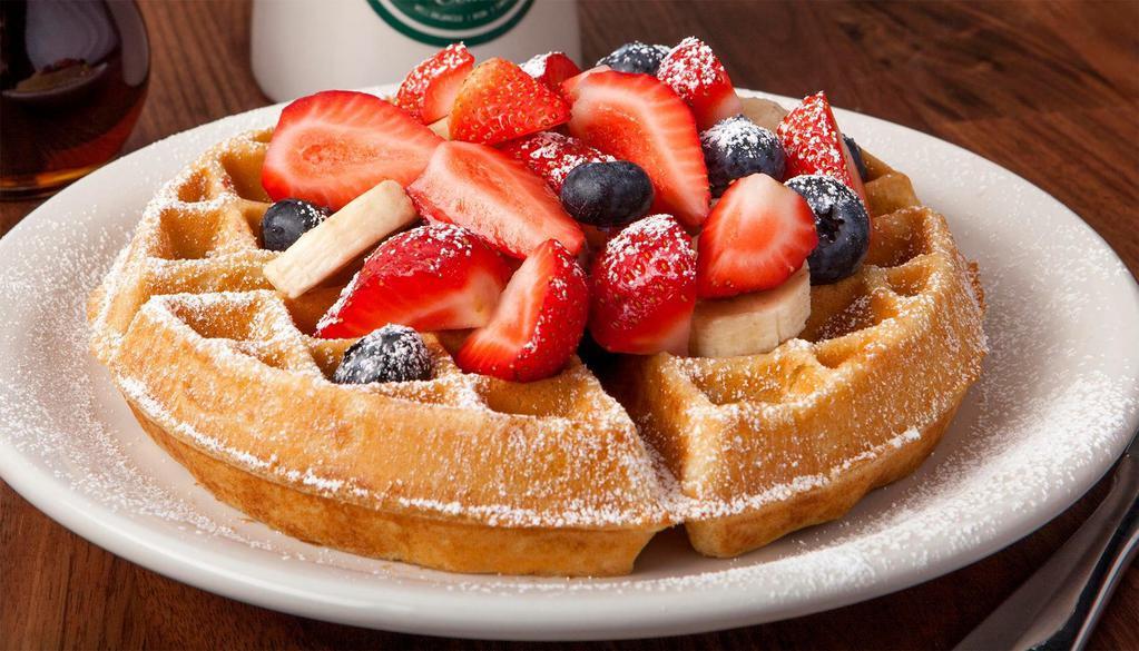 Fruity Waffle · Our Belgian waffle topped with blueberries, strawberries, bananas and powdered sugar.