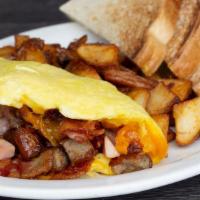 Meat Lovers Omelet · Bacon, sausage, ham and cheddar cheese. Served with toast and your choice of hashbrowns or g...