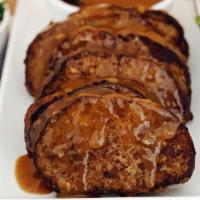 Iron City Meatloaf For 4 · Our famous griddle-seared meatloaf with rich brown gravy, creamy mashed potatoes and green b...