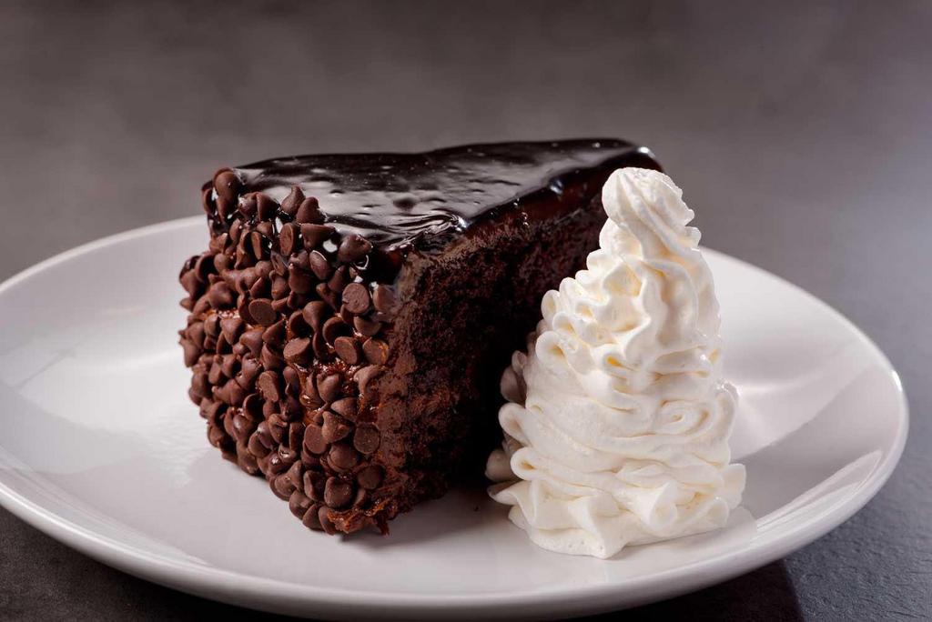 Chocolate Cake · Double layer chocolate cake infused with rich Hershey’s® fudge icing and chocolate chip morsels.