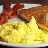 Kid’S Platter · 1 scrambled egg, 2 slices of bacon, 1 slice of toast and grits.