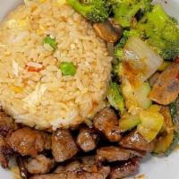 Steak Rockin Bowl · Traditional Japanese Fried Rice, Hot Hibachi vegetables, cooked to perfection Filet Mignon m...