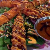 Tnt Shrimp · It’s dy-na-mite. Crispy shrimp tempura glazed with sweet chili, savory eel sauce and a sprin...