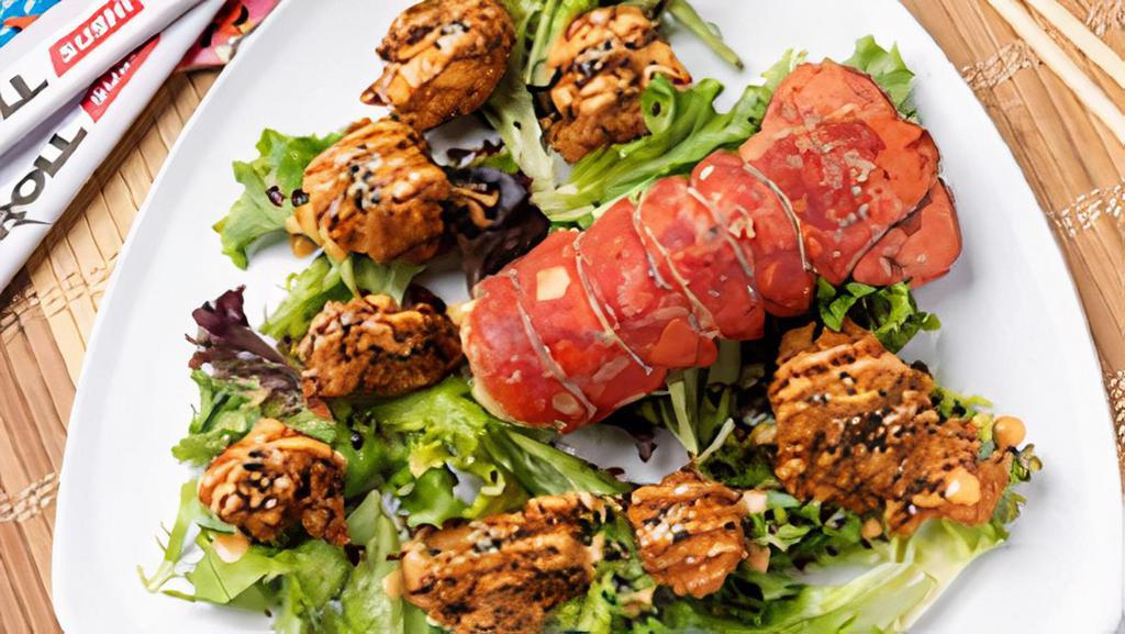 Rockin Lobster · Tails wins. Whole tempura lobster tail drizzled with our signature spicy-sweet-creamy headbanger sauce, savory eel sauce and a sprinkle of sesame seeds.