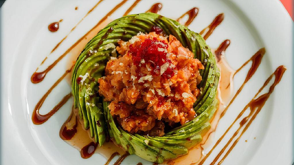 Twisted Tuna · Our spin on tuna tartare. Chopped, spicy red tuna and coolly twisted avocado topped with tobiko, sweet chili, eel sauce and crunchy flakes.