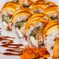 The Experience Roll · Shrimp tempura, cream cheese and. cucumber inside, sliced mango outside, topped with sweet c...