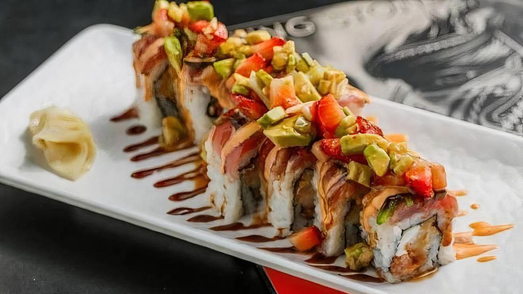 Punk Rock Roll · Shrimp tempura, spicy tuna, cream cheese inside, seared tuna outside, topped with strawberry-avocado-jalapeno-cucumber salad, sweet-chili-ponzu dressing, spicy mayo, and eel sauce. Spicy!