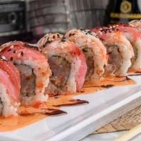 Jam Sesh Roll · Gang’s all here. Yellowtail, albacore tuna and spicy mayo inside, red tuna and crab stick ou...