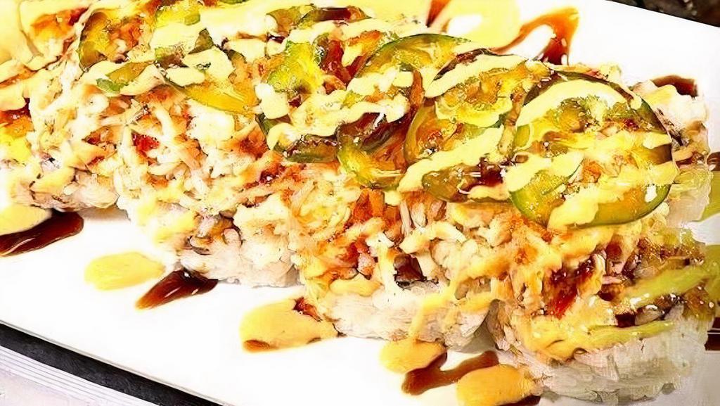 Electric Roll · Cajun seasoned crawfish, cream cheese, crab stick inside, baked krabmeat and jalapenos outside, topped with spicy mayo, sweet chili and eel sauce.