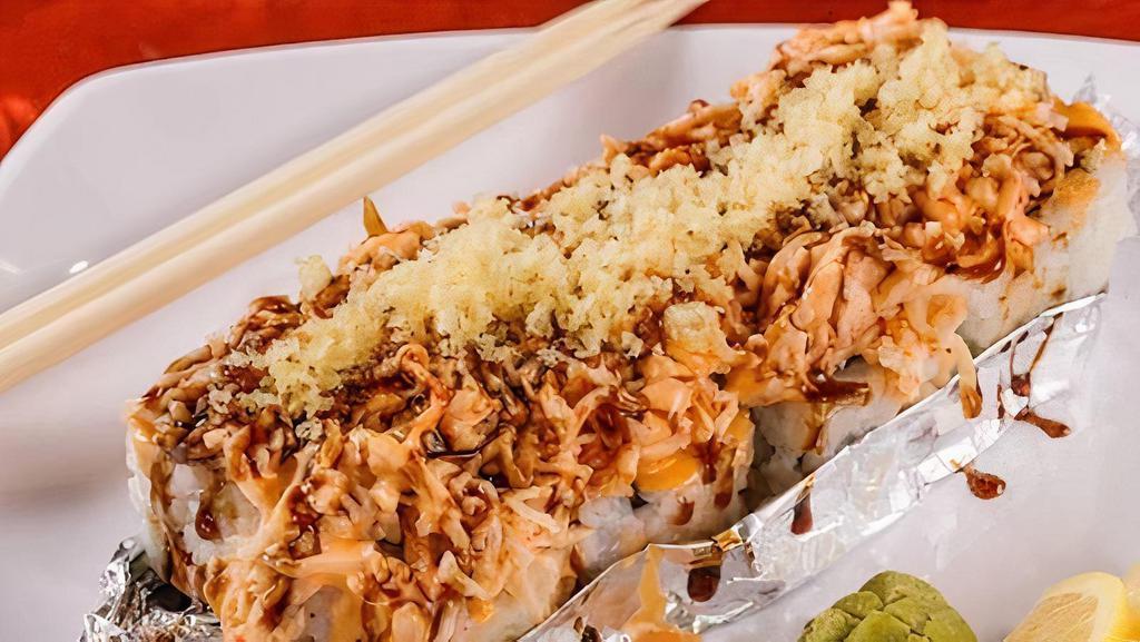 Volcano Roll · California roll topped with baked krabmeat, spicy mayo, eel sauce, crunchy flakes and fully baked.