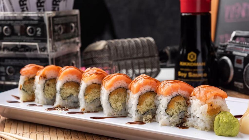 Super Crunch Roll · Crunchy flakes and spicy mayo inside, smoked salmon outside, topped with eel sauce.