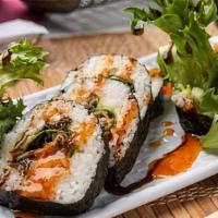 Spider Roll · Soft-shell crab tempura, cucumber, avocado, spring mix inside, topped with sweet chili and e...