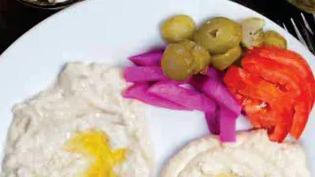 Appetizer Platter · Hummus, baba ghanoush, grape leaves, kibbi, and falafel.