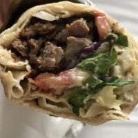 Lamb Shawarma · Sliced Lamb with tomato, onions, parsley, sumak, with the choice of toppings.