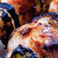 Shish Tawouk · Marinated grilled chicken breast, grilled to perfection with green peppers, red peppers, and...
