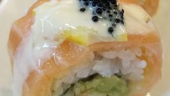 Salmon Lemon Roll · Shrimp tempura roll, wrapped in salmon and topped with lemon, special mayo and black tobiko....