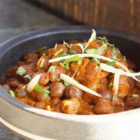 Chana Masala · Gluten free, Spicy. Vegetarian.  Chickpeas, onion, tomato, cilantro, Indian spices.
