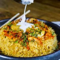 Chicken Biryani · Gluten free. Basmati rice, egg, chicken, and spices.