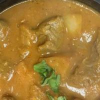 Lamb Achari · Lamb pieces cooked in a gravy with a delicately spiced Indian pickle assortment.