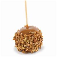 Pecan Caramel Apple · A fresh granny smith apple drenched in home-made copper-kettle caramel and adorned with peca...
