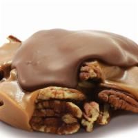 Milk Pecan Snapper · Mammoth pecan halves in a pool of home-made copper-kettle caramel covered with Kilwins milk ...