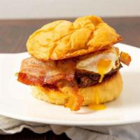 Hangover Burger · 100% all-American premium cut 1/2 pound beef burger. Topped with smokehouse bacon, cheddar c...