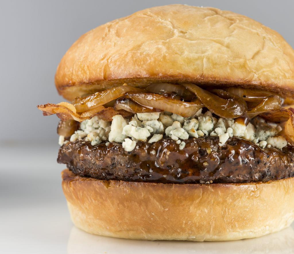 Bourbon Burger · 100% all-American premium cut 1/2 pound beef burger. Topped with sweet bourbon sauce, smokehouse bacon, and bourbon caramelized onions, crumbled bleu cheese. (item includes lettuce, tomato, and onion on the side.)