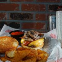 The Works Burger · 100% all-American premium cut 1/2 pound beef burger. Topped with smokehouse bacon, American ...