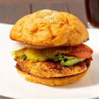 Grilled Chicken Sandwich · Served with lettuce, tomato, onion and pickles on the side.