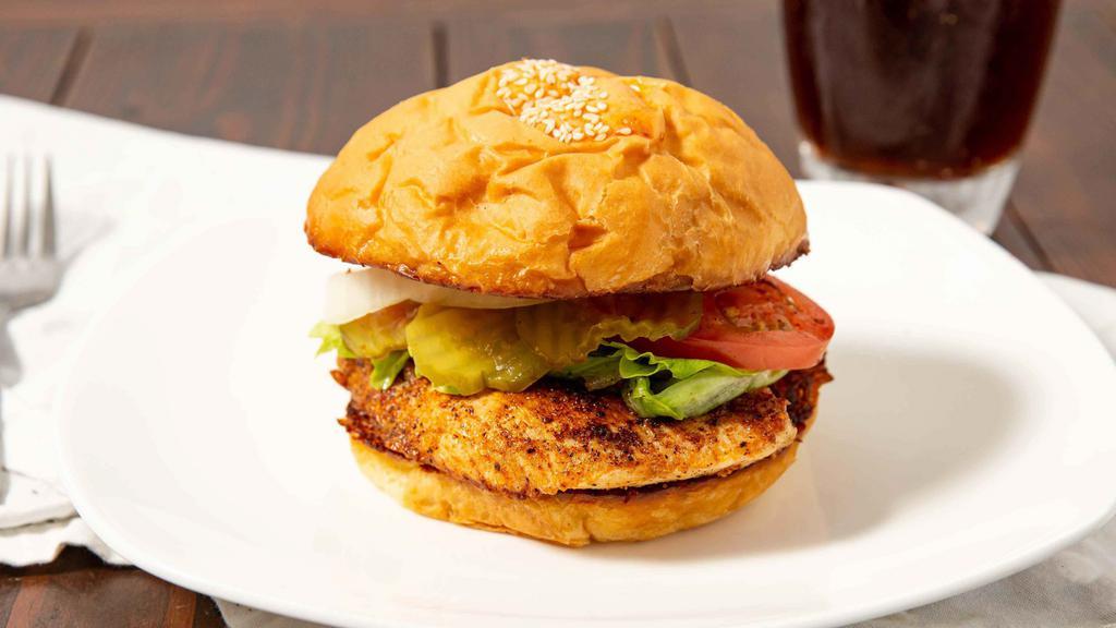 Grilled Chicken Sandwich · Served with lettuce, tomato, onion and pickles on the side.