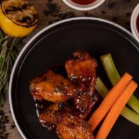 Chicken Wings · Your choice of: buffalo sauce, sweet chili lime or guava barbecue.