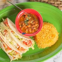 South Of The Border Tacos · Three tacos with your choice of chicken, ground beef, brisket or pulled pork with lettuce, t...