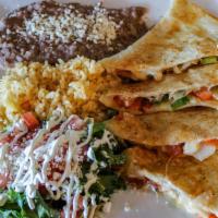 Fajita Quesadilla · A flour tortilla stuffed with grilled chicken, cheese, onions, bell peppers, and tomatoes. S...