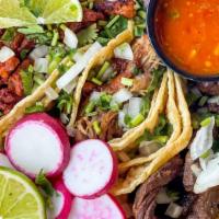 Street Taco Basket · Served in corn tortillas with onions, cilantro, and a side of al pastor salsa. Choose any co...
