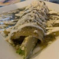 Avocado & Cheese Enchilada · Corn tortilla stuffed with avocado and shredded cheese. Topped with green tomatillo sauce, s...