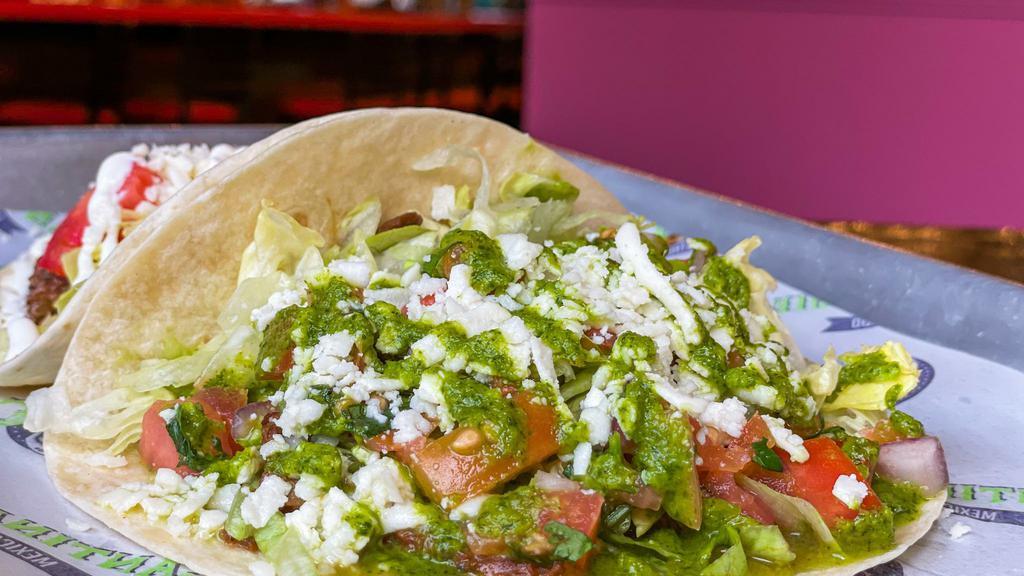 Chimi Chimi Bang Bang · Skirt steak with chimichurri sauce, fresh lime pico de gallo, lettuce, and queso fresco. Served in a flour tortilla.