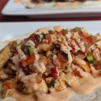 Hot Surfer Chick · Grilled chicken breast, pineapple salsa, and sriracha ranch. Served in a flour tortilla.