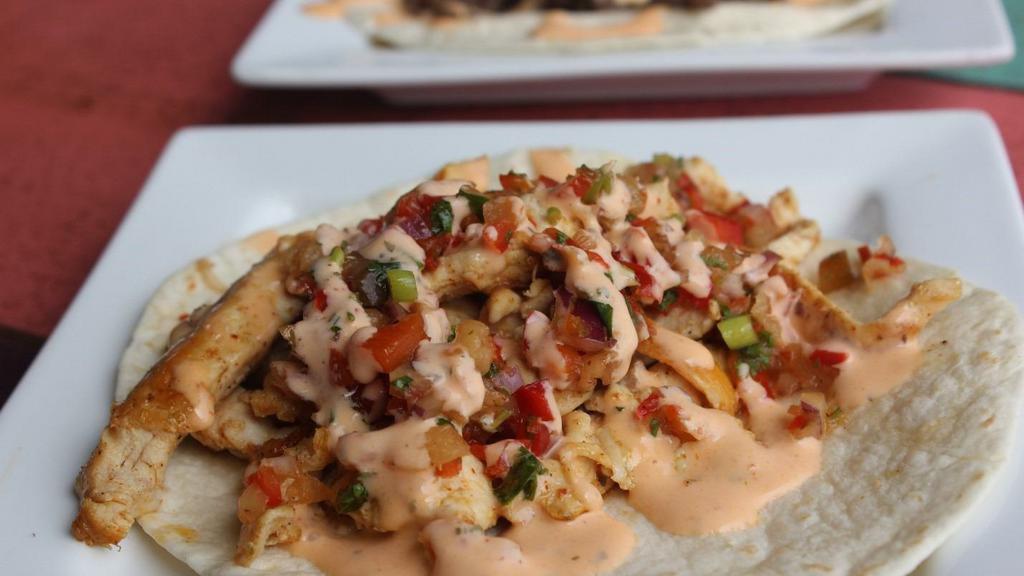 Hot Surfer Chick · Grilled chicken breast, pineapple salsa, and sriracha ranch. Served in a flour tortilla.