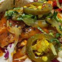 Grouper Taco · Lightly breaded and grilled grouper, slaw, peruvian sauce, cilantro, and bread and butter ja...