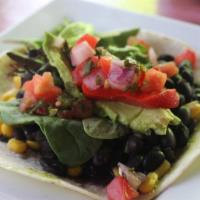 Veggie Taco · Lettuce, black bean salsa, white rice vegetable medley, corn, fresh lime pico de gallo, and ...