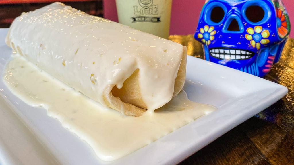 California Burrito · Grilled chicken, lettuce, rice, refried beans, sour cream, guacamole, and topped with queso dip.