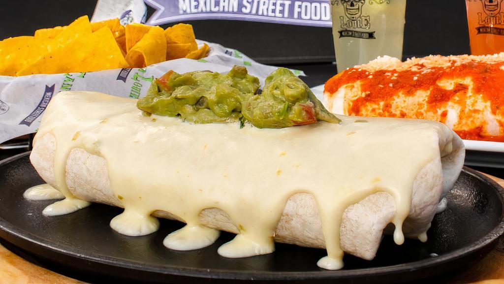 Fajita Burrito · Steak, shrimp, chicken, peppers, onions, tomatoes, rice, and sour cream. Topped with queso dip and guacamole.