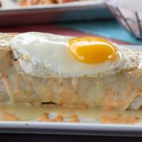 Sunrise Burrito · Chorizo, eggs, French fries, and guacamole. Topped with queso dip, sunny-side egg, and srira...