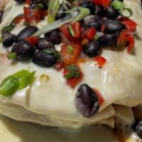 Veggie Burrito · Zucchini, peppers, onions, tomatoes, corn, white rice vegetable medley, and black bean salsa...