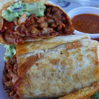 Burrito Al Pastor · Al pastor (marinated pork), pineapple salsa, guacamole, and queso dip. Served with a side of...